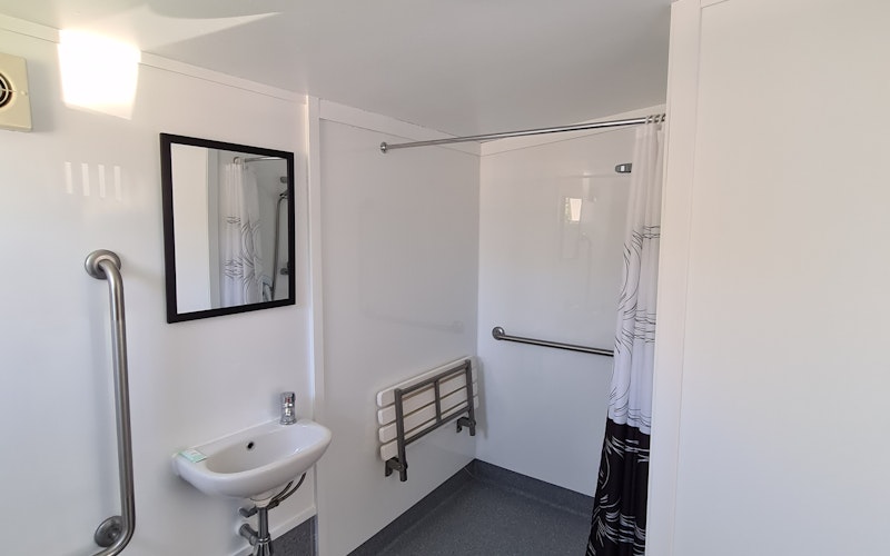 Our Self-contained units have all that one will need for wee holiday.  Featuring a bed in the lounge, TV and table and chairs plus small kitchenette, a spare bed in the bedroom, and a bathroom.  