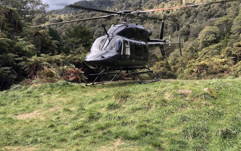 Bell 427 sitting in a clearing amongst the trees
